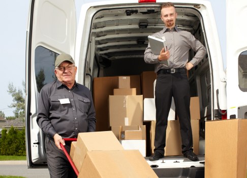 Office relocation scene with moving boxes and equipment in Hatton
