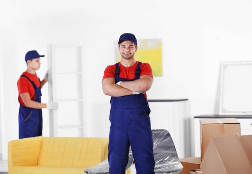 Household furniture being carried during removals in Hatton
