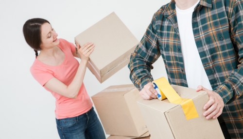 Family organizing belongings into a Hatton storage unit