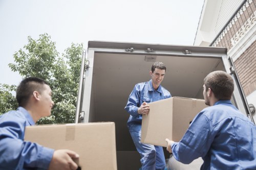 Professional movers packing household items for removals in Hatton